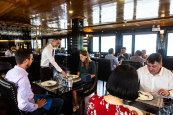 Guests dining on Alova Premium Cruise in Ha Long Bay