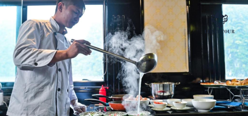 Chef preparing Vietnamese cuisine on Alova Premium Cruise