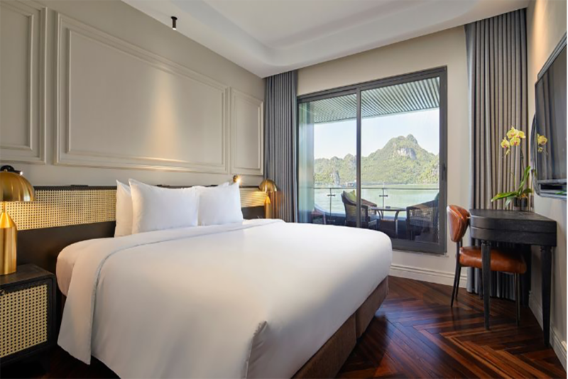 Luxurious bedroom with balcony and stunning Ha Long Bay view on Elite of the Seas Cruise