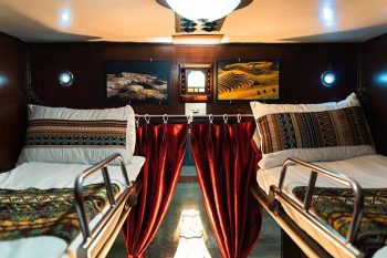 Luxurious cabin interior with leather seats and modern amenities on the Family Express Train Hanoi to Lao Cai Sapa
