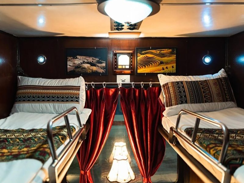 Luxurious cabin interior with leather seats and modern amenities on the Family Express Train Hanoi to Lao Cai Sapa