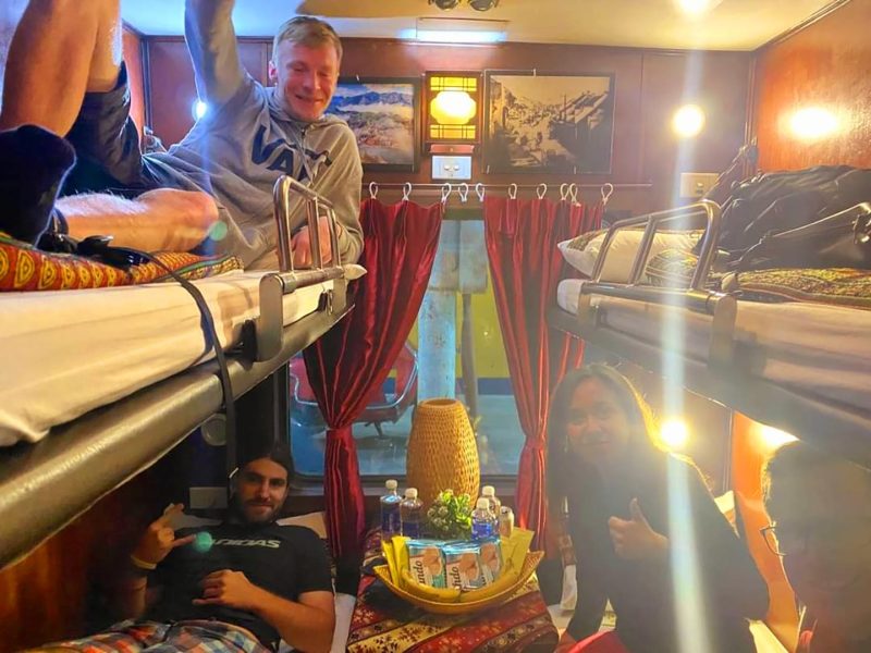 Luxurious cabin interior with leather seats and modern amenities on the Family Express Train Hanoi to Lao Cai Sapa