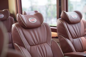 Comfortable leather seats in a 16-seater Felix Limousine for Hanoi to Halong Bay transfer