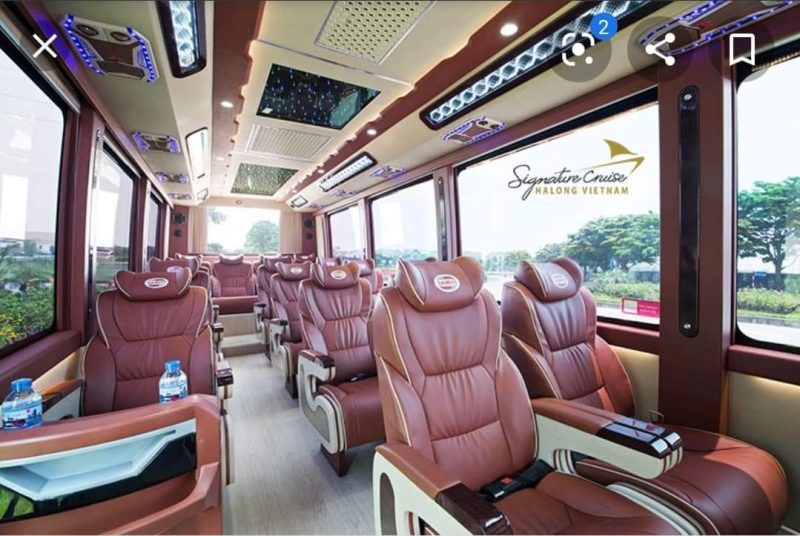 Interior view of the Signature Cruise Felix Limousine 16-seater luxury bus for Hanoi to Ha Long Bay transfer, featuring leather seats and ceiling lighting