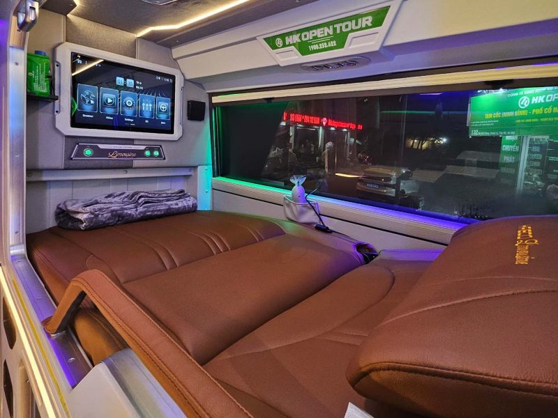Luxurious cabin interior with leather seats and modern amenities on the HK Open Tour bus from Hanoi to Sapa