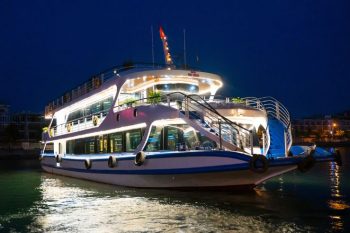 Luxury cruise ship docked at night in Ha Long Bay