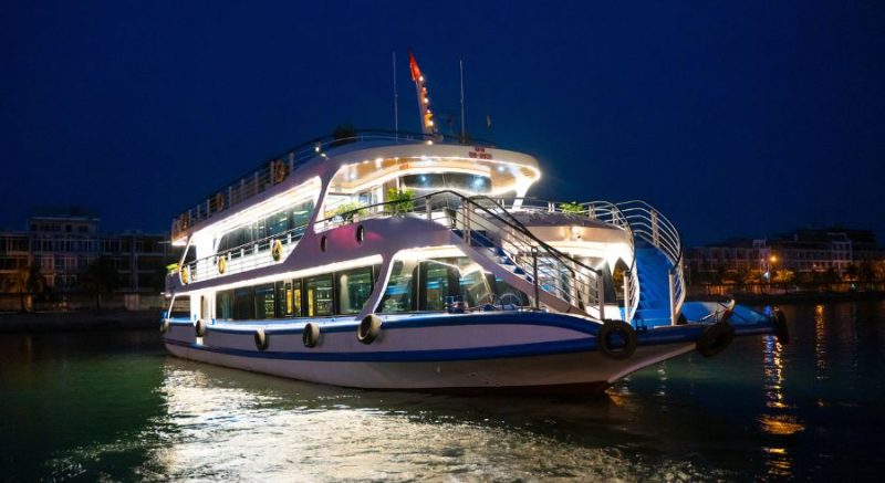 Luxury cruise ship docked at night in Ha Long Bay