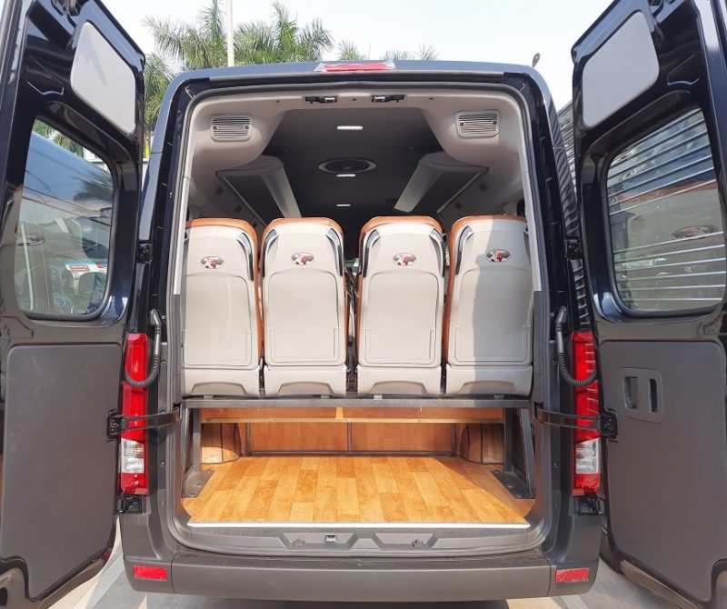 Rear view of a luxury limousine van showing spacious and comfortable seating for tours from Hanoi to Ha Long Bay