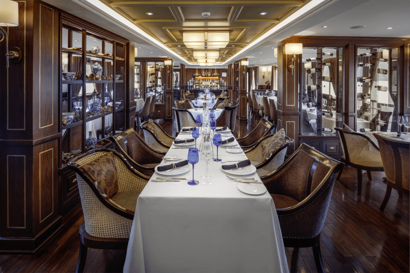 Elegant dining area on the Paradise Elegance Cruise with sophisticated table settings and luxurious decor