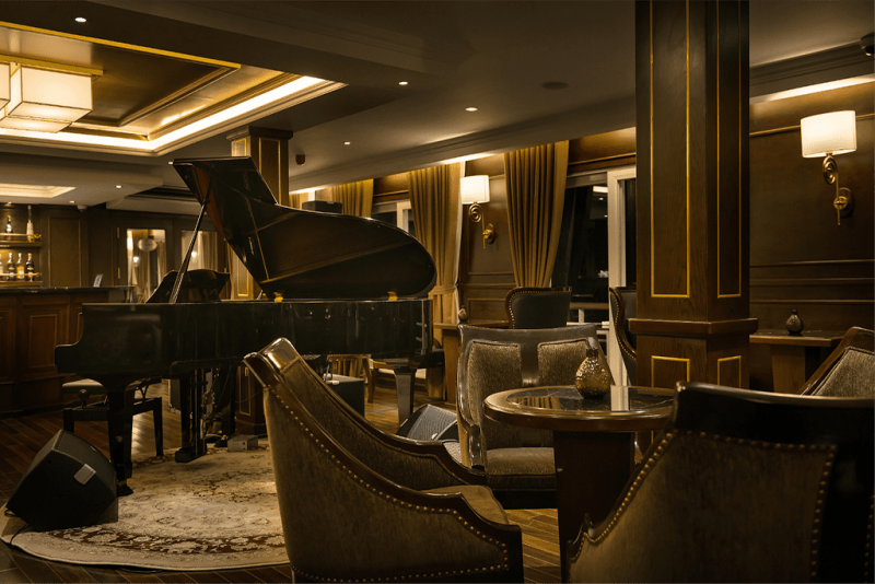Luxurious piano lounge aboard the Paradise Elegance Cruise in Halong Bay