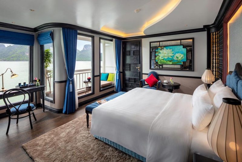 Luxurious bedroom on Verdure Lotus Cruise with panoramic Ha Long Bay view