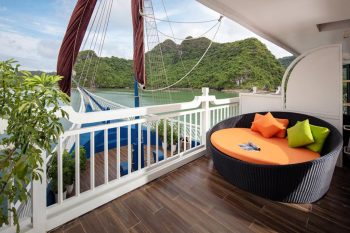 Luxurious outdoor seating area with scenic view of Ha Long Bay on the Verdure Lotus Cruise.