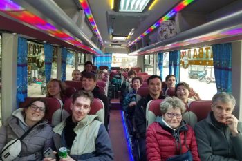 Luxco Travels - Happy passengers on 35-seater shuttle bus from Hanoi to Halong Bay