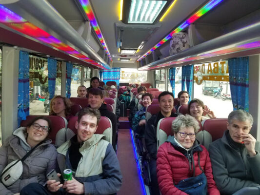 Luxco Travels - Happy passengers on 35-seater shuttle bus from Hanoi to Halong Bay