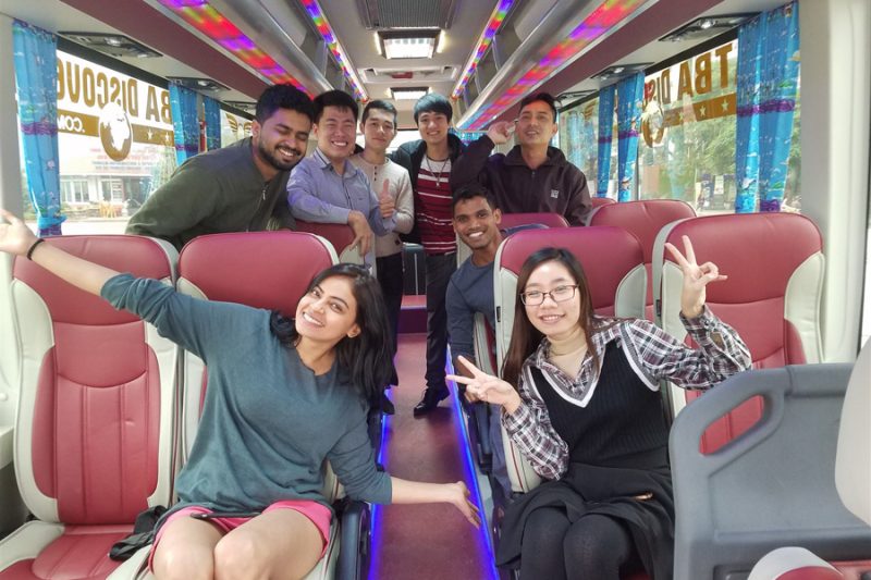 Happy passengers enjoying Luxco Travels' 35-seater shuttle bus from Hanoi to Halong Bay
