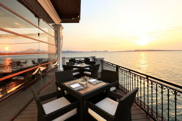 Enjoying a delicious lunch at seaview restaurants in Ha Long Bay - Luxco Travels, Ha Long Bay tours, Vietnam, dining with a view.