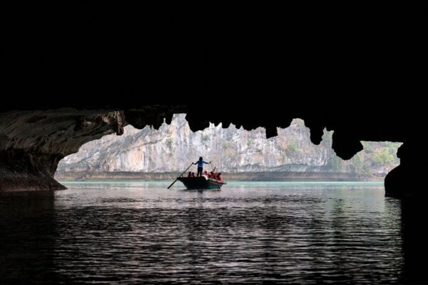 Exploring the caves in Ha Long Bay - Luxco Travels, Ha Long Bay tours, Vietnam, adventure activities.