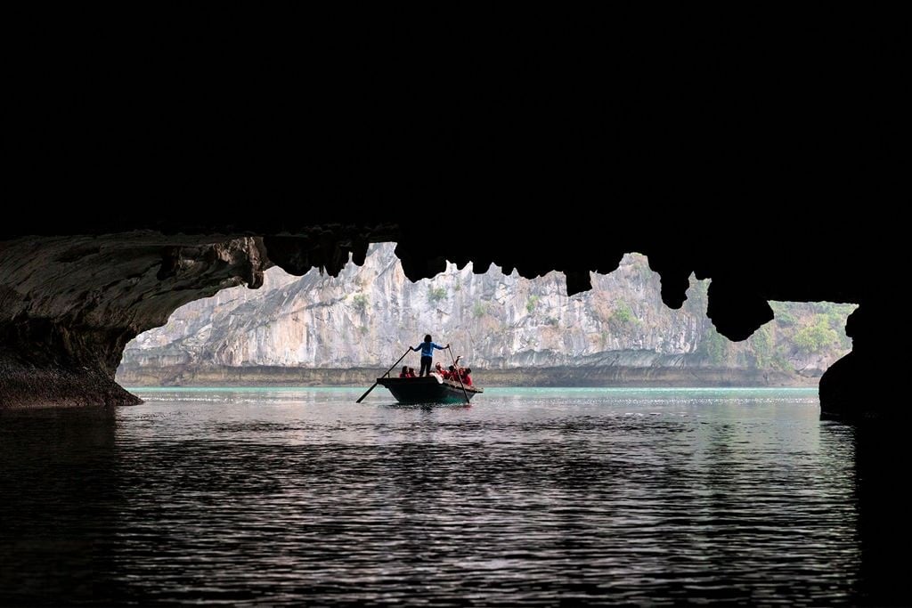 Exploring the caves in Ha Long Bay - Luxco Travels, Ha Long Bay tours, Vietnam, adventure activities.