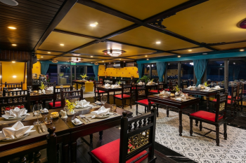 Elegant dining setup on Nostalgia Cruise in Ha Long Bay