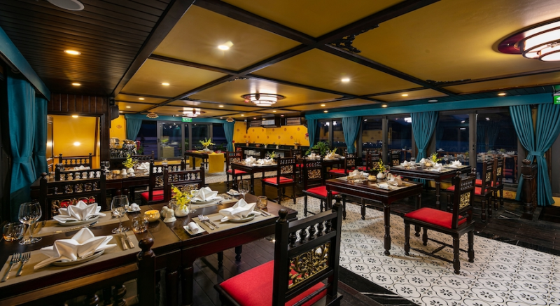 Elegant dining setup on Nostalgia Cruise in Ha Long Bay