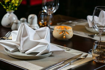 Elegant table setting for dining on Nostalgia Cruise in Ha Long Bay
