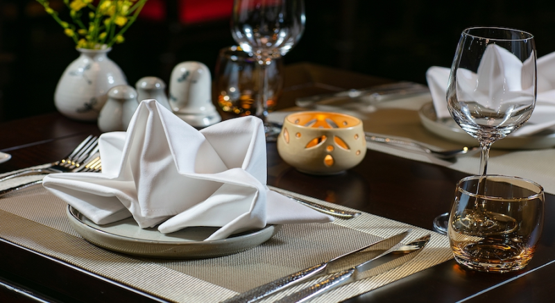 Elegant table setting for dining on Nostalgia Cruise in Ha Long Bay