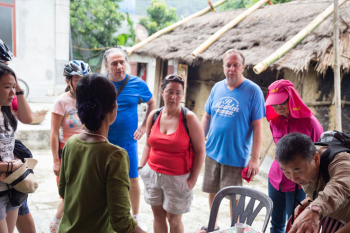 Tourists experiencing local culture in Ha Long Bay village