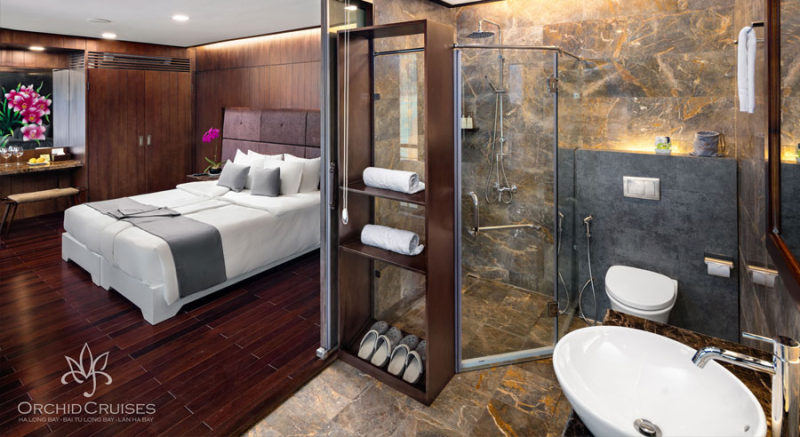 Luxurious bedroom and bathroom on Orchid Classic Cruise in Ha Long Bay
