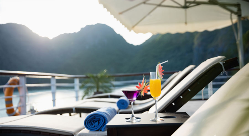 Refreshing cocktails on the sun deck of Orchid Classic Cruise in Ha Long Bay