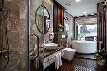 Luxurious bathroom with a view on the Orchid Trendy Cruise, Ha Long Bay, Vietnam - Featuring a spacious bathtub and elegant design