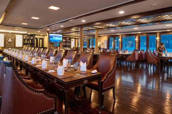 Elegant dining area on the Orchid Trendy Cruise, Ha Long Bay, Vietnam - Perfect for enjoying gourmet meals with stunning views.
