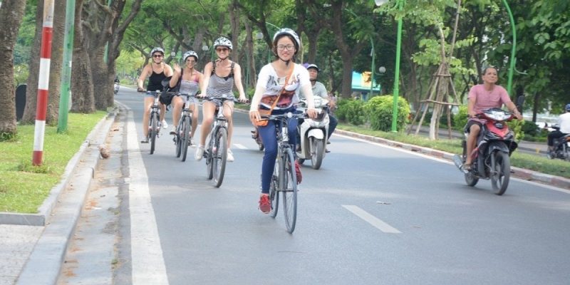 Biking tour of Hanoi backstreet Vietnam - LuxcoTravels explore local culture street food historical landmarks cycling adventure