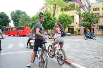 Biking tour of Hanoi backstreet Vietnam - LuxcoTravels cultural experience local life hidden gems traditional markets historical sites scenic routes cycling adventure