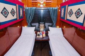 Luxurious cabin interior with leather seats and modern amenities on the Vic Express Train Hanoi to Lao Cai Sapa