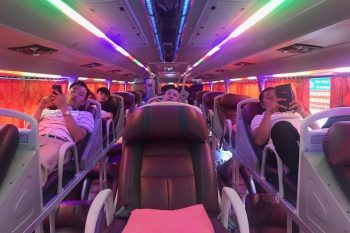 Sleeping bus interior with leather seats and modern amenities on the Dragon Sleeping bus from Hanoi to Sapa