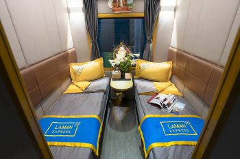 Luxurious cabin interior with leather seats and modern amenities on the Laman Express Train Hanoi to Lao Cai Sapa