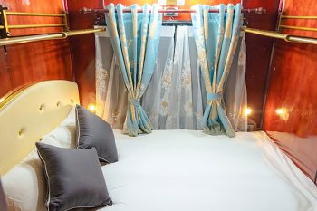 Luxurious cabin interior with leather seats and modern amenities on the Vic Express Train Hanoi to Lao Cai Sapa