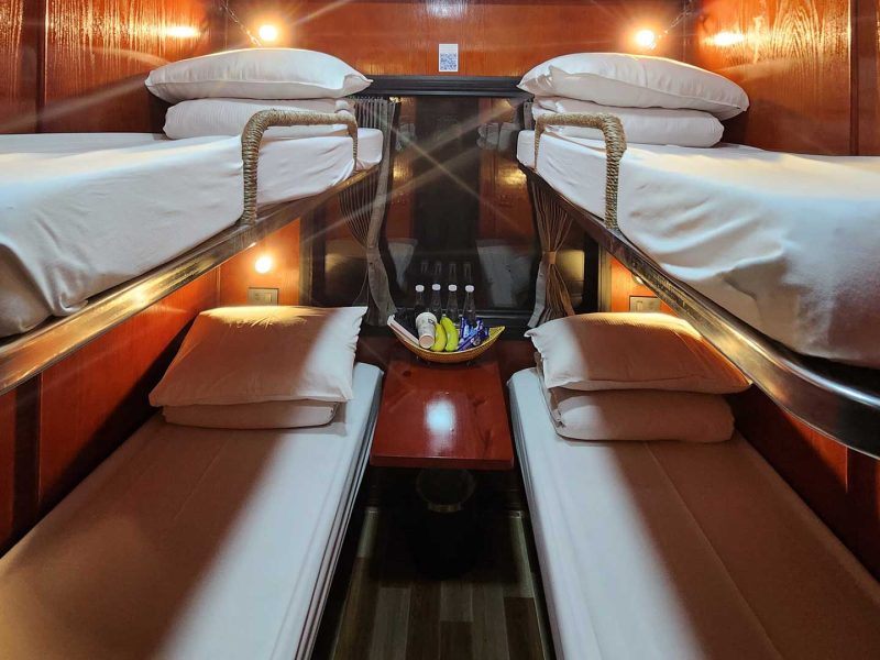 Luxurious cabin interior with leather seats and modern amenities on the Vic Express Train Hanoi to Lao Cai Sapa