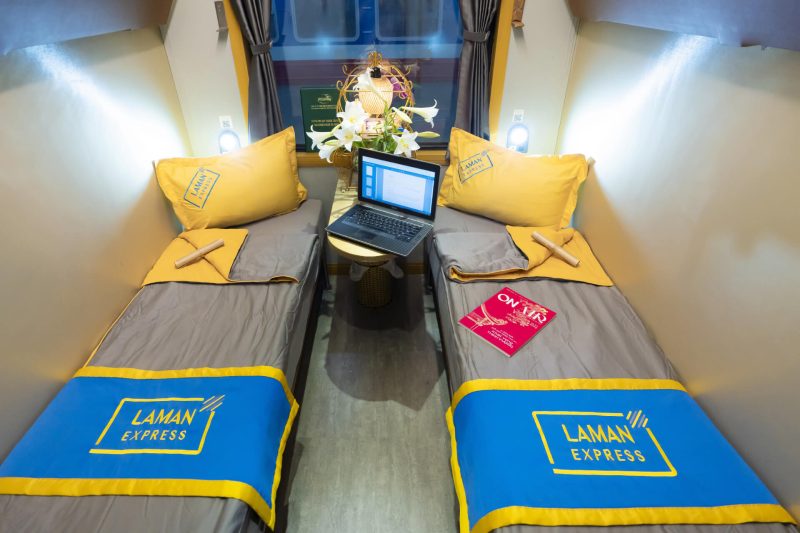 Luxurious cabin interior with leather seats and modern amenities on the Laman Express Train Hanoi to Lao Cai Sapa