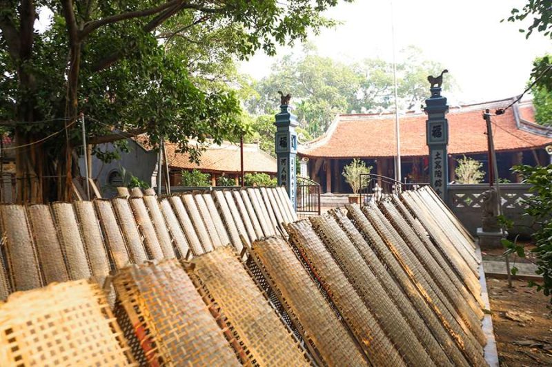 Traditional bamboo frames drying in Tho Ha village, reflecting Vietnamese craftsmanship and culture.